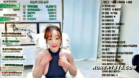 Busty Korean webcam MILF smiles teasing with huge cleavage in black top