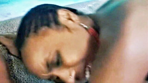 Ebony woman with braids in close intimate pose with partner