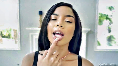 Maya Bijou teases with glossy lips and sultry gaze in sexy top