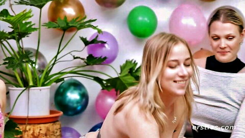 Three busty blonde babes smiling close together at colorful balloon party amateur truth or dare