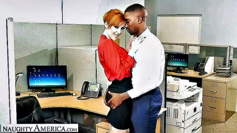 Redhead MILF in office grabs black coworker's ass while he squeezes hers in naughty embrace