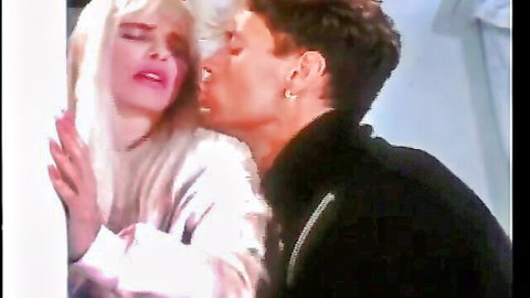 Blonde beauty passionately kissing handsome stud in steamy encounter