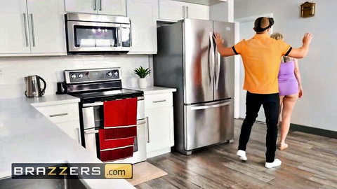 Dee Williams in tight purple dress teases cock in kitchen anal scene