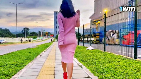 Jenifer Play in tight pink dress walking outdoors, teasing curves