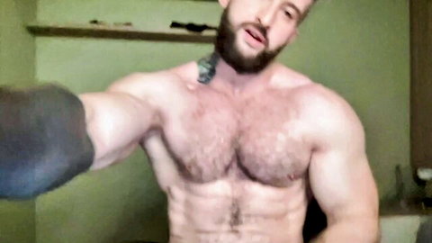 Musclegod_ua muscular bearded man flexing hairy chest and abs