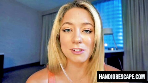 River Lynn blonde teases with lips, smiling seductively in orange top