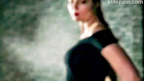 Pretty blonde in black dress, side profile for BDSM whipping scene