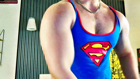 Muscular white guy Arilass in tight Superman tank top, showing off ripped abs and chest