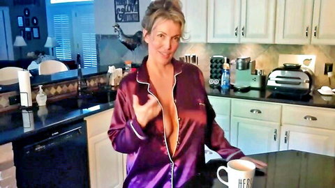 Seductive blonde MILF in open purple satin robe teasing with coffee