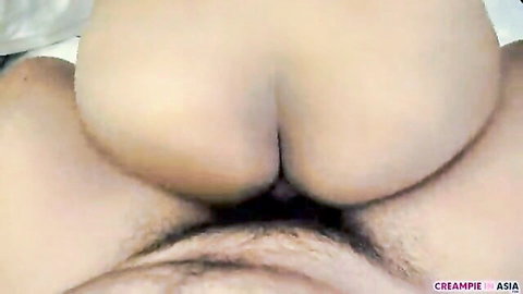 Asian woman creampie close-up, semen leaking from shaved pussy after sex