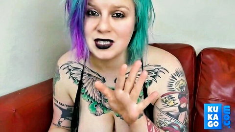 Tattooed big-tit stepsister with green-purple hair shows cleavage