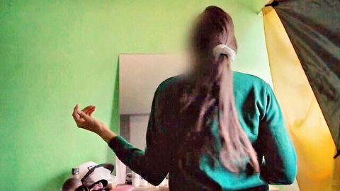 Petite Latina amateur in green sweater poses from behind in bedroom mirror