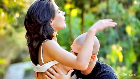 Stunning beautiful teen with exposed breasts in tender outdoor embrace
