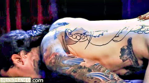 Tattooed muscular man pegged anally by dominatrix in BDSM store