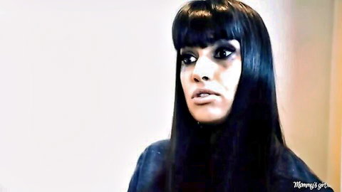 Busty Lisa Ann seductive close-up, black bangs and intense gaze