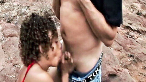 Thin African woman giving outdoor blowjob to shirtless driver