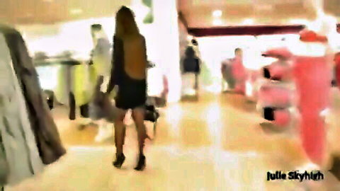 Brunette MILF shopping in short black dress with hidden buttplug