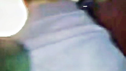 South Asian babe pulls down white sweater exposing huge natural tits smiling at camera