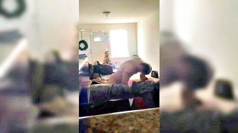 Hairy muscular guy fucking tattooed man's ass doggy style on Christmas bed