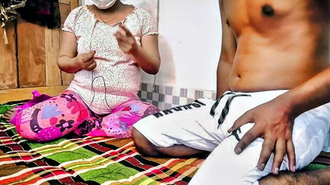 Desi stepsister in blouse and pants teases shirtless stepbrother on mat