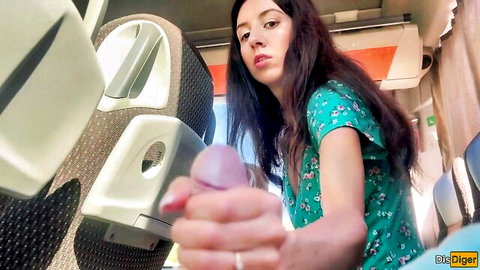 Brunette in floral dress grabs cock for handjob on public bus