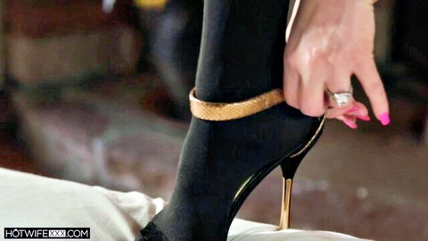 Hotwife adjusts black stockings and gold stiletto heels with diamond ring on pink nails