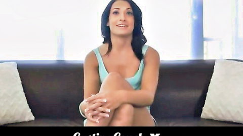 Smiling Latina gymnast in blue tank top on casting couch