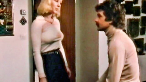 Vintage blonde schoolgirl in sheer sweater and skirt chats with man