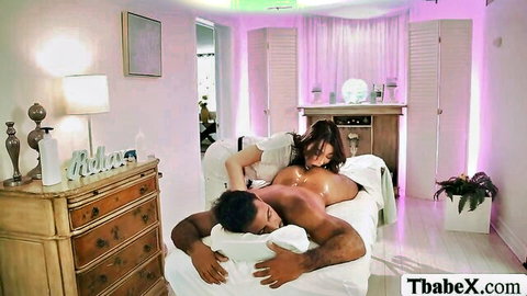 Busty Asian masseuse gives sensual nude massage to muscular man
