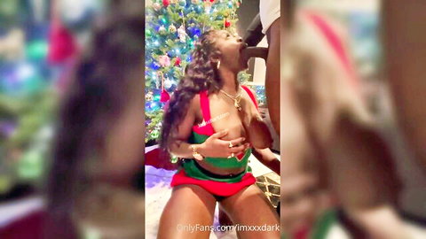 Jenise Hart in sexy Santa outfit giving blowjob to black man at Christmas