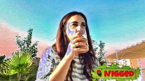 Bitch goddess Lola sips drink outdoors in striped shirt, teasing vibe in Nigged porn