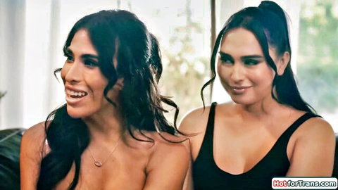 Ember Fiera and busty tgirl friend topless, smiling intimately