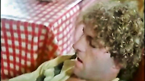 Close-up of curly-haired man in ecstasy during vintage deep penetration