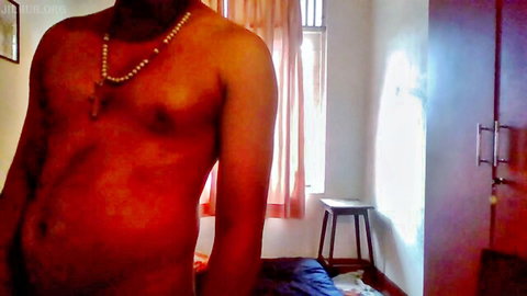 Shirtless Indian man Tina Baby posing nude in bedroom
