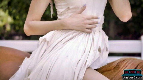 Eliza Ibarra posing sexy in torn white dress outdoors