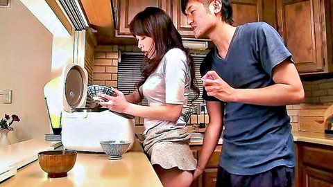 Sexy Japanese brunette in short skirt bends over kitchen counter as guy gropes her ass