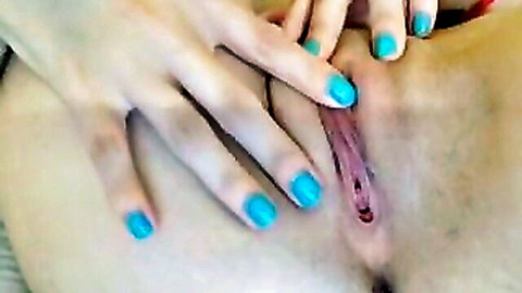 Amateur girl with turquoise nails spreads her wet pink pussy wide open