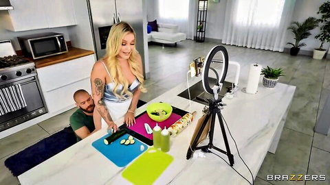 Blonde in shiny silver dress bends over kitchen counter as tattooed guy grabs her small ass from behind