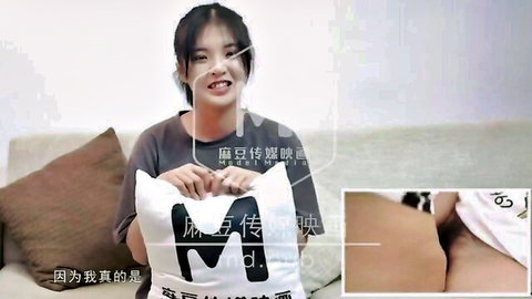 Smiling Asian teen holds pillow with creampie close-up in tight pussy