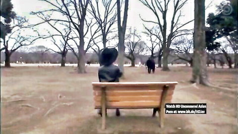 Chinese JAV star Aika in leather jacket on park bench