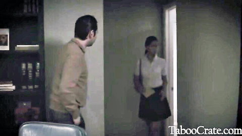 Brunette teen in blouse and skirt seeks comfort from male counselor