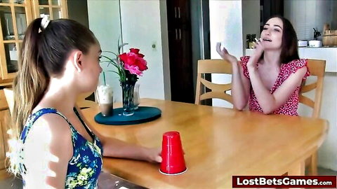Two young lesbians in dresses play hot strip dice game, loser eats pussy