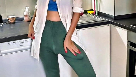 Horny stepmom in open white shirt and tight green pants poses seductively