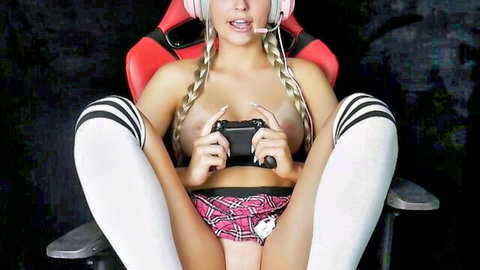 Topless blonde gamer girl with pigtails spreads legs flashing shaved pussy and perky tits holding controller