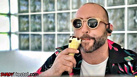 Bald bearded man in sunglasses and floral shirt licks ice cream teasingly, MMF threesome with perky boobed babe