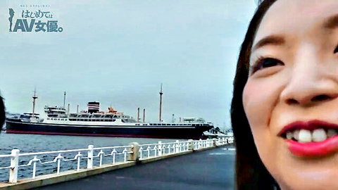 Smiling Asian woman takes selfie at harbor with black luxury liner ship in background, JAV teaser