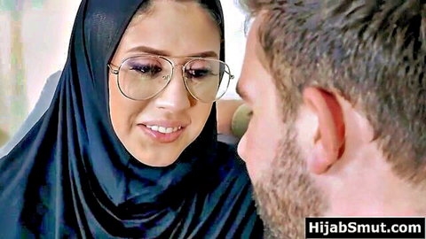 Hijab Muslim girl in glasses smiles at guy during anal sex negotiation