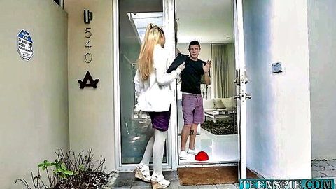 Blonde Melody Parker in white coat, purple miniskirt, stockings teasing guy at door