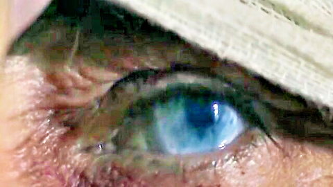 Seductive close-up of nun's piercing blue eye in hot adult video