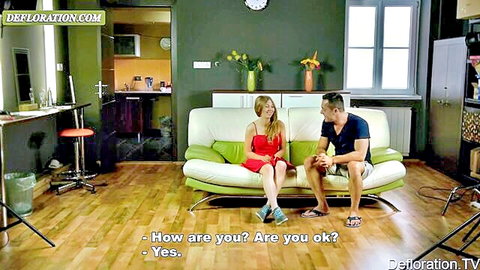 Hungarian teen Galina Fox in red dress chatting intimately with guy on couch